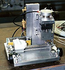 Machine Fixture for De-Gating Injection Molded Part